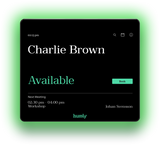 An image of the front of the Humly Room Display. The room name and details of the next meeting are all visible on the display. The LED lights around the edge of the screen are green to indicate the room is currently available.