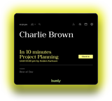 An image of the front of the Humly Room Display. The room name and details of the next meeting are all visible on the display. The LED lights around the edge of the screen are yellow to indicate the room is expected to be occupied soon.