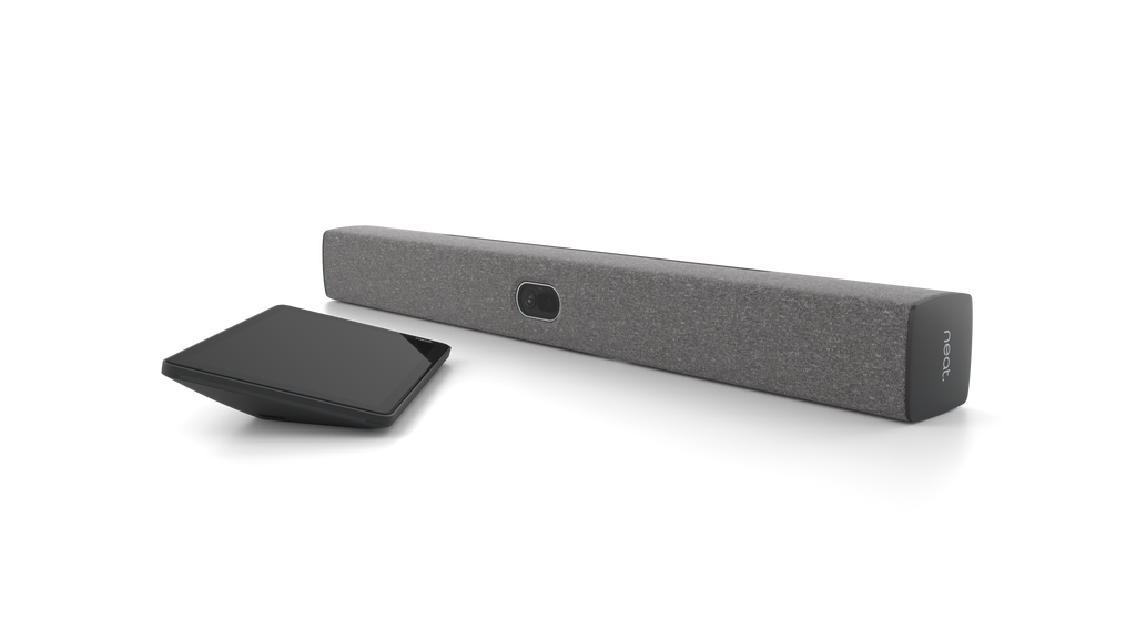 An angled view of the Neat Bar 2, a video bar for video conferencing. It is dark grey in colour. Next to it is a tablet-style touchscreen, the Neat Pad.