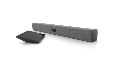 An angled view of the Neat Bar 2, a video bar for video conferencing. It is dark grey in colour. Next to it is a tablet-style touchscreen, the Neat Pad.
