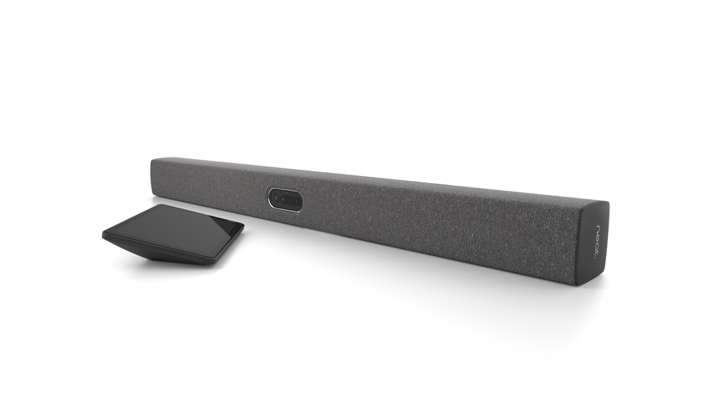 An angled view of the Neat Bar Pro, a video bar for video conferencing. It is dark grey in colour. Next to it is a tablet-style touchscreen, the Neat Pad.